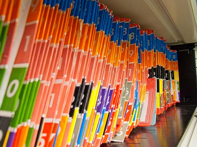 Rows of vocational and medical case files in a records room.