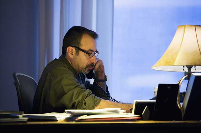 A VocMed case manager working with a client by phone.